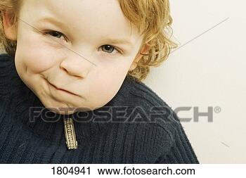 Stock Photography - portrait of a 
boy making face. 
fotosearch - search 
stock photos, 
pictures, images, 
and photo clipart