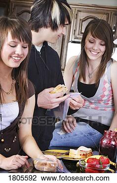 Stock Photo - siblings making 
lunch together. 
fotosearch - search 
stock photos, 
pictures, images, 
and photo clipart