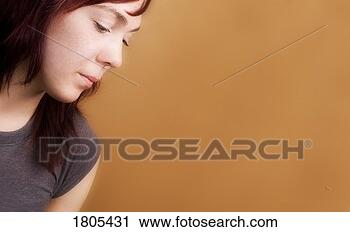 Stock Photography - side view of a 
sad woman. fotosearch 
- search stock 
photos, pictures, 
images, and photo 
clipart