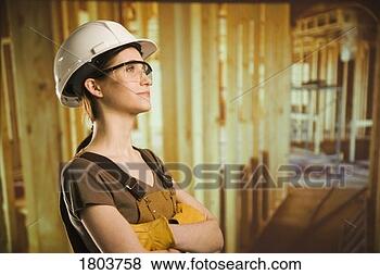Stock Photo - side view of a 
woman wearing 
helmet and smiling. 
fotosearch - search 
stock photos, 
pictures, images, 
and photo clipart