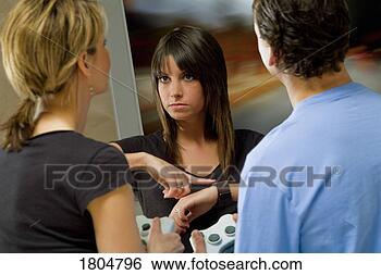 Stock Photo - teenager angry 
with friends for 
being late from 
playing video 
games. fotosearch 
- search stock 
photos, pictures, 
images, and photo 
clipart