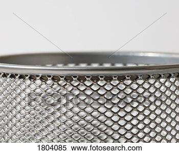 Stock Image - top of mesh metal 
pencil holder. 
fotosearch - search 
stock photos, 
pictures, images, 
and photo clipart