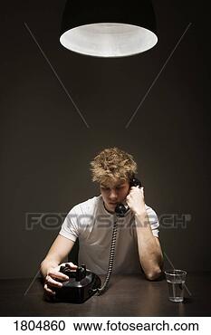 Stock Photography - young man talking 
on the phone. 
fotosearch - search 
stock photos, 
pictures, images, 
and photo clipart