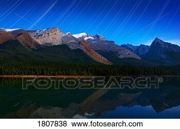 Stock Photo - starry night panoramic 
of mountains and 
lake,  maligne 
lake,  jasper. 
fotosearch - search 
stock photos, 
pictures, images, 
and photo clipart