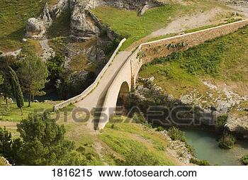 Stock Image - restored medieval 
stone bridge leading 
to the castle 
at alarcón. fotosearch 
- search stock 
photos, pictures, 
images, and photo 
clipart