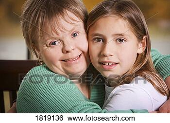 Stock Photo - two girls hugging. 
fotosearch - search 
stock photos, 
pictures, images, 
and photo clipart