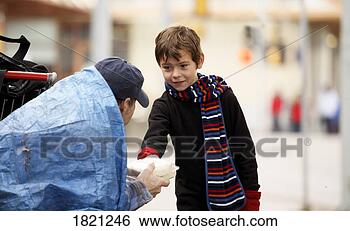 Stock Photo - child giving homeless 
man food. fotosearch 
- search stock 
photos, pictures, 
images, and photo 
clipart