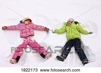 Stock Photo - children making 
snow angels. fotosearch 
- search stock 
photos, pictures, 
images, and photo 
clipart