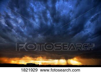Stock Photograph - dark clouds and 
a sunset. fotosearch 
- search stock 
photos, pictures, 
images, and photo 
clipart