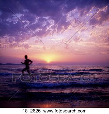 Stock Photo - man running in 
the water. fotosearch 
- search stock 
photos, pictures, 
images, and photo 
clipart