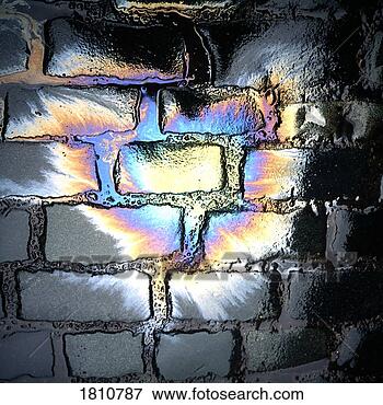Picture - oil slick on cobblestones. 
fotosearch - search 
stock photos, 
pictures, images, 
and photo clipart