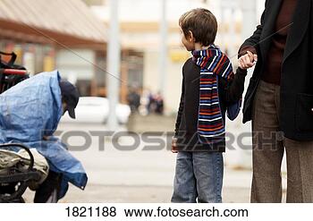 Stock Photo - passing by a homeless 
man. fotosearch 
- search stock 
photos, pictures, 
images, and photo 
clipart