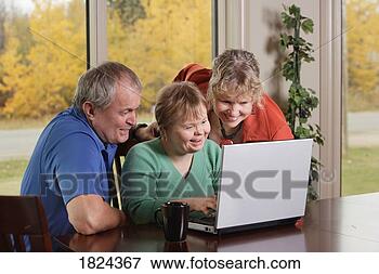 Picture - family on laptop 
computer. fotosearch 
- search stock 
photos, pictures, 
images, and photo 
clipart