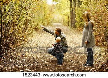 Stock Photo - family out for 
a walk. fotosearch 
- search stock 
photos, pictures, 
images, and photo 
clipart