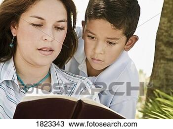 Stock Photo - mother and son 
reading a bible. 
fotosearch - search 
stock photos, 
pictures, images, 
and photo clipart
