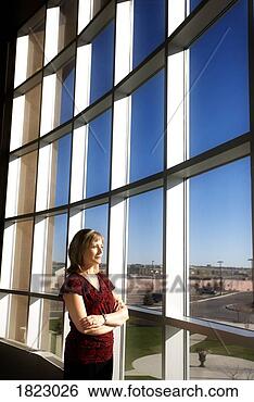 Stock Photo - woman watching 
out a window. 
fotosearch - search 
stock photos, 
pictures, images, 
and photo clipart