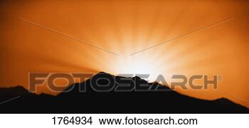 Stock Photo - sunrise/sunset 
and a mountain 
horizon. fotosearch 
- search stock 
photos, pictures, 
images, and photo 
clipart