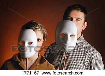 Picture - caucasian man 
and woman with 
white masks. fotosearch 
- search stock 
photos, pictures, 
images, and photo 
clipart