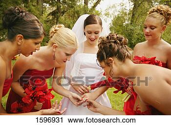 Stock Photography - bridesmaids admire 
ring. fotosearch 
- search stock 
photos, pictures, 
images, and photo 
clipart
