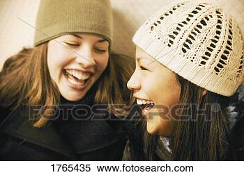Stock Image - two girls with 
toques. fotosearch 
- search stock 
photos, pictures, 
images, and photo 
clipart