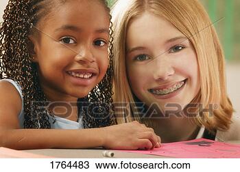Stock Photo - two girls color 
together. fotosearch 
- search stock 
photos, pictures, 
images, and photo 
clipart