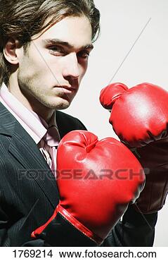 Stock Photo - businessman with 
boxing gloves. 
fotosearch - search 
stock photos, 
pictures, images, 
and photo clipart