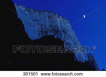 Stock Photography - cliff face in 
moonlight. fotosearch 
- search stock 
photos, pictures, 
images, and photo 
clipart