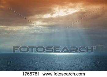 Stock Photography - sun breaking through 
the cloud. fotosearch 
- search stock 
photos, pictures, 
images, and photo 
clipart