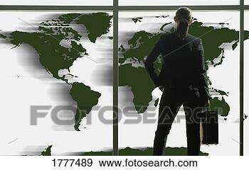 Stock Photograph - business woman 
looking at world 
map. fotosearch 
- search stock 
photos, pictures, 
images, and photo 
clipart