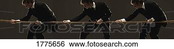 Stock Photo - three men in suits 
pulling on a rope 
in a tug 'o' war. 
fotosearch - search 
stock photos, 
pictures, images, 
and photo clipart