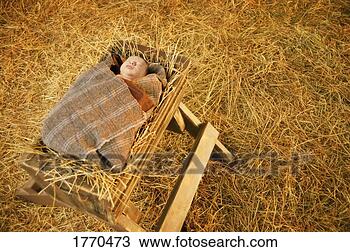 Stock Photo - baby jesus lying 
in a manger. fotosearch 
- search stock 
photos, pictures, 
images, and photo 
clipart