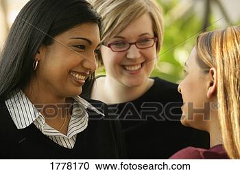 Stock Photography - girlfriends talking. 
fotosearch - search 
stock photos, 
pictures, images, 
and photo clipart