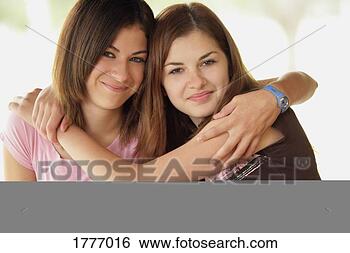 Stock Photo - two friends hugging. 
fotosearch - search 
stock photos, 
pictures, images, 
and photo clipart