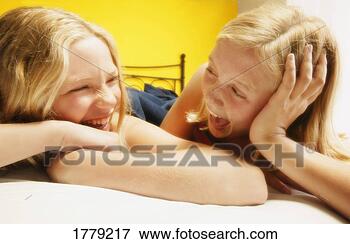 Picture - two girls laugh 
together. fotosearch 
- search stock 
photos, pictures, 
images, and photo 
clipart