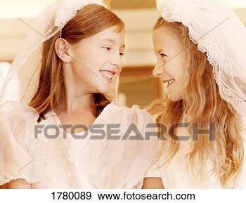 Stock Photograph - two girls share 
smiles. fotosearch 
- search stock 
photos, pictures, 
images, and photo 
clipart