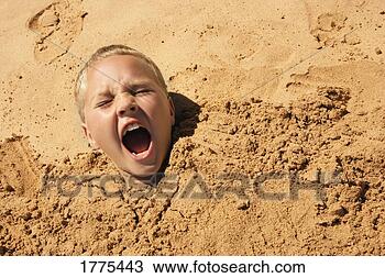 Stock Photo - young boy covered 
in sand. fotosearch 
- search stock 
photos, pictures, 
images, and photo 
clipart