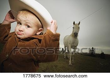 Stock Image - cowboy and a horse. 
fotosearch - search 
stock photos, 
pictures, images, 
and photo clipart