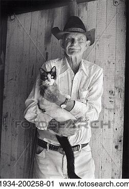 Stock Photography - usa, oklahoma, 
hardesty, retired 
cowboy and cat. 
fotosearch - search 
stock photos, 
pictures, images, 
and photo clipart