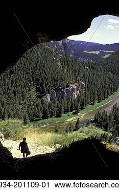 Stock Photography - montana, smith 
river, person 
walking through 
cave. fotosearch 
- search stock 
photos, pictures, 
images, and photo 
clipart