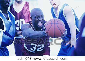 Stock Photo - man catching basketball, 
surrounded by 
other players. 
fotosearch - search 
stock photos, 
pictures, images, 
and photo clipart