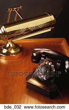 Stock Photo - desk with brass 
lamp and antique 
phone. fotosearch 
- search stock 
photos, pictures, 
images, and photo 
clipart