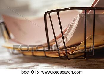 Stock Image - metal tray filled 
in documents. 
fotosearch - search 
stock photos, 
pictures, images, 
and photo clipart