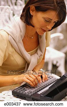 Picture - woman typing on 
laptop. fotosearch 
- search stock 
photos, pictures, 
images, and photo 
clipart