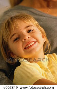 Stock Photograph - smiling girl lying 
down. fotosearch 
- search stock 
photos, pictures, 
images, and photo 
clipart