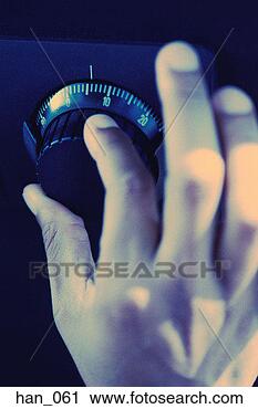 Stock Photography - man's hand rotating 
dial on combination 
lock. fotosearch 
- search stock 
photos, pictures, 
images, and photo 
clipart