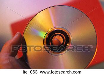 Stock Photo - hand holding compact 
disc. fotosearch 
- search stock 
photos, pictures, 
images, and photo 
clipart