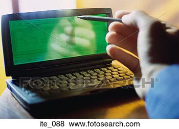 Stock Photo - man using electronic 
diary. fotosearch 
- search stock 
photos, pictures, 
images, and photo 
clipart