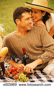 Stock Photograph - couple having 
picnic. fotosearch 
- search stock 
photos, pictures, 
images, and photo 
clipart