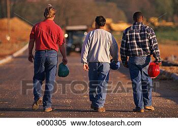 Stock Image - three men carrying 
hard hats walking 
down road, back 
view. fotosearch 
- search stock 
photos, pictures, 
images, and photo 
clipart