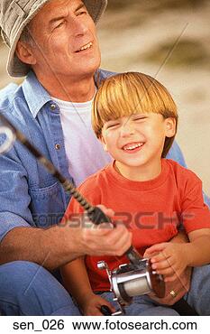 Stock Photo - man holding fishing 
pole, boy sitting 
in his lap. fotosearch 
- search stock 
photos, pictures, 
images, and photo 
clipart